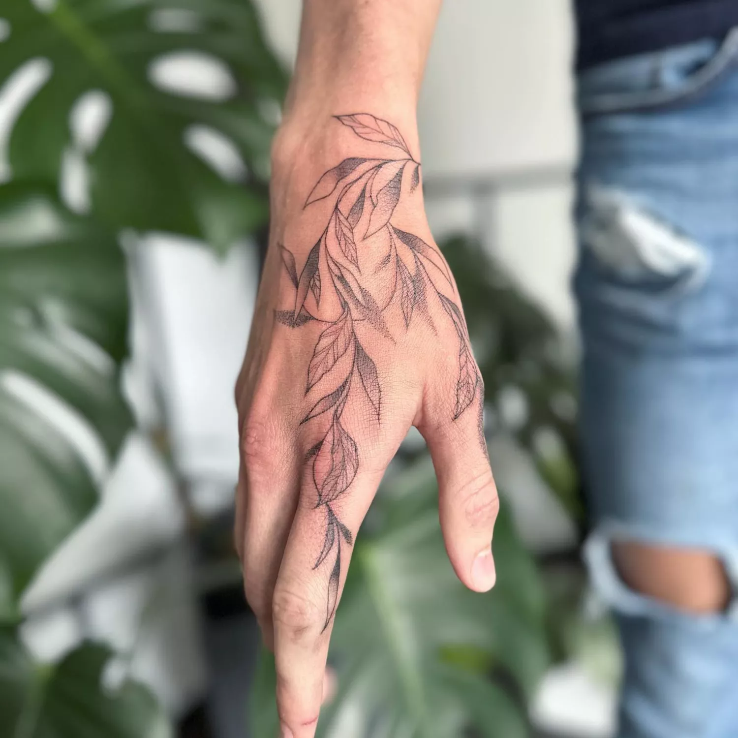 tattoo of leaves on hand