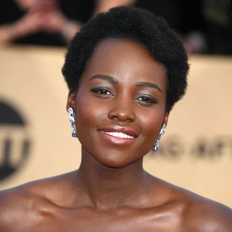 Lupita Nyong'o wears a short Afro hairstyle