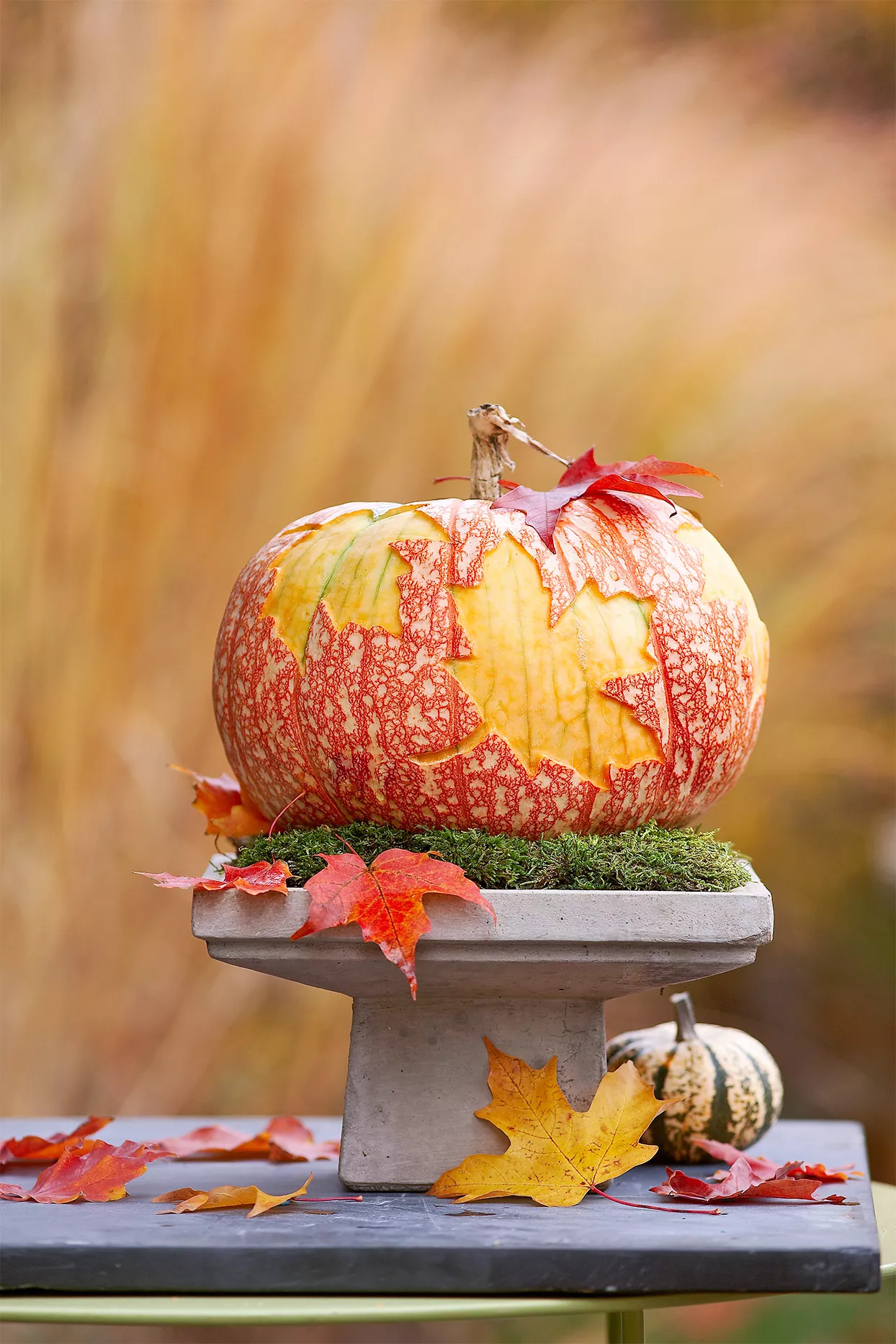 pumpkin carved with leaf shapes