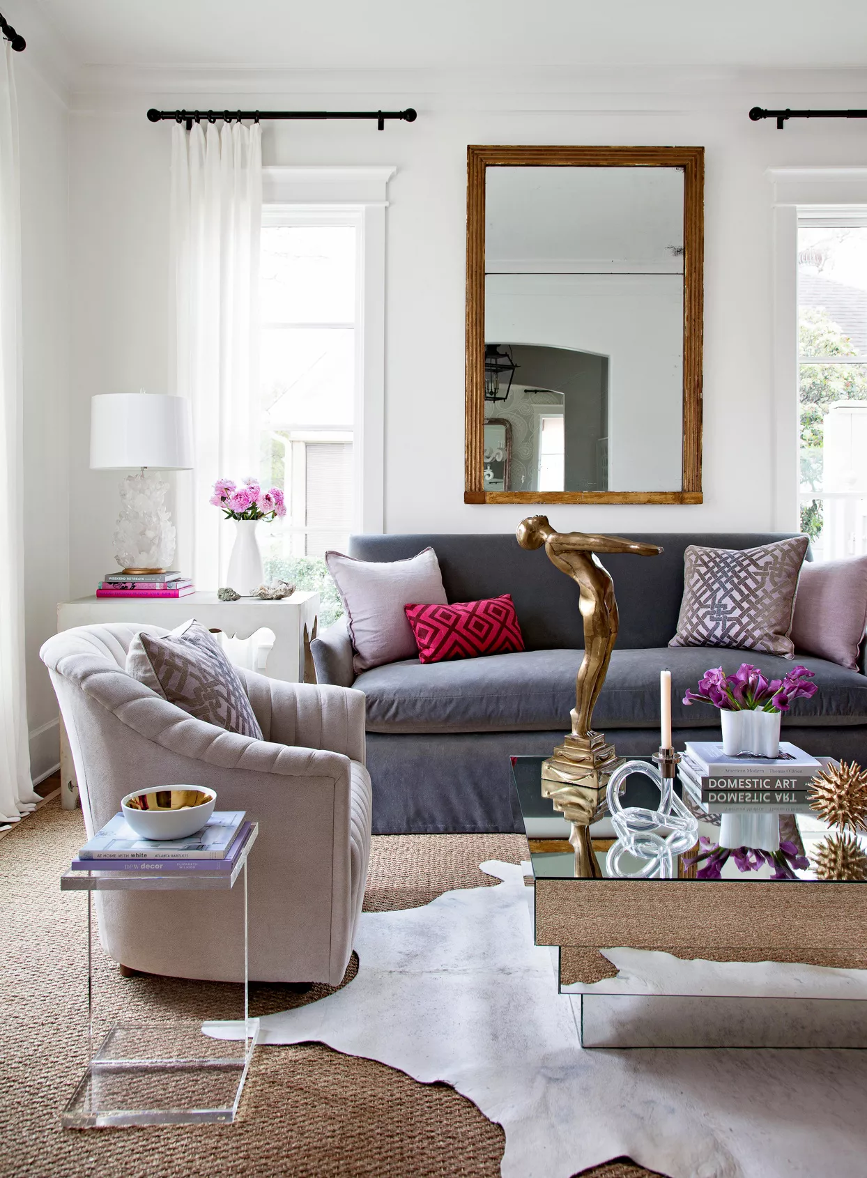 dark grey sofa below mirror