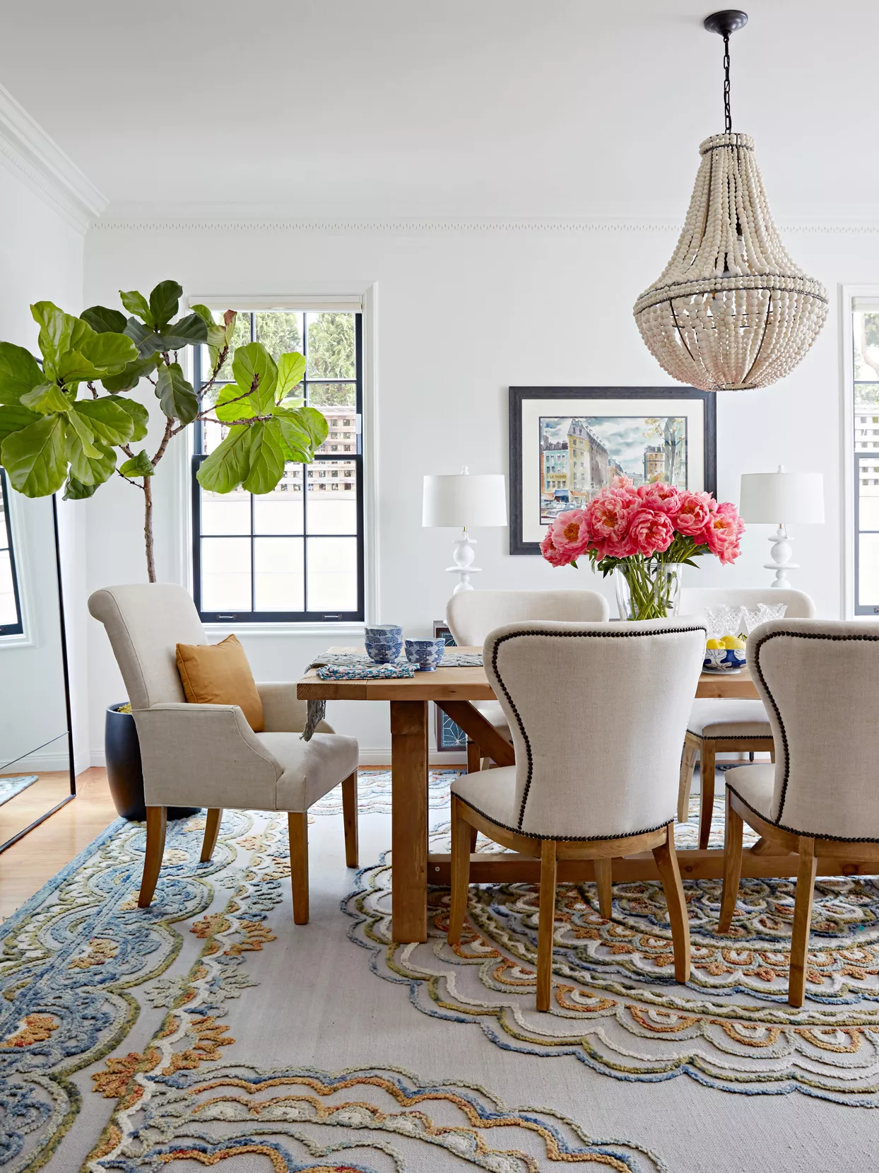 neutral-colored dining room with fiddle leaf fig tree