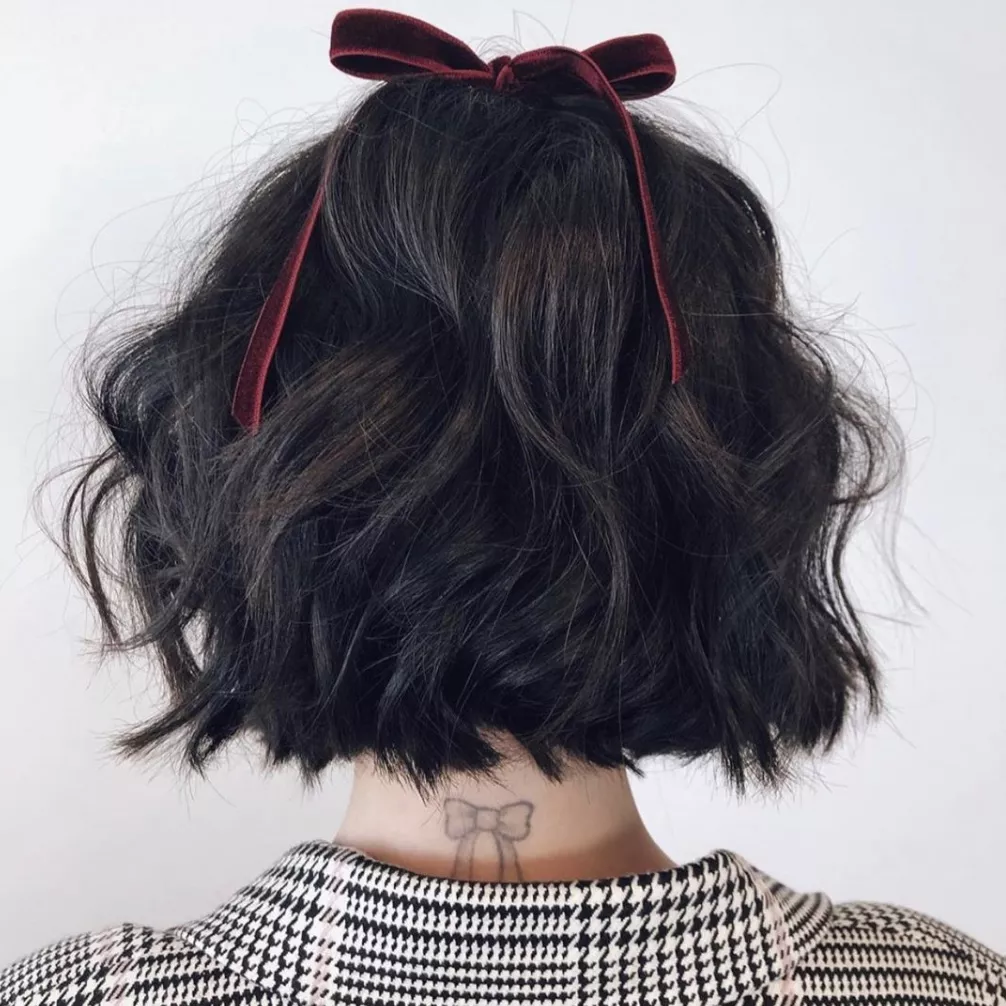 Lucy Hale bow tattoo