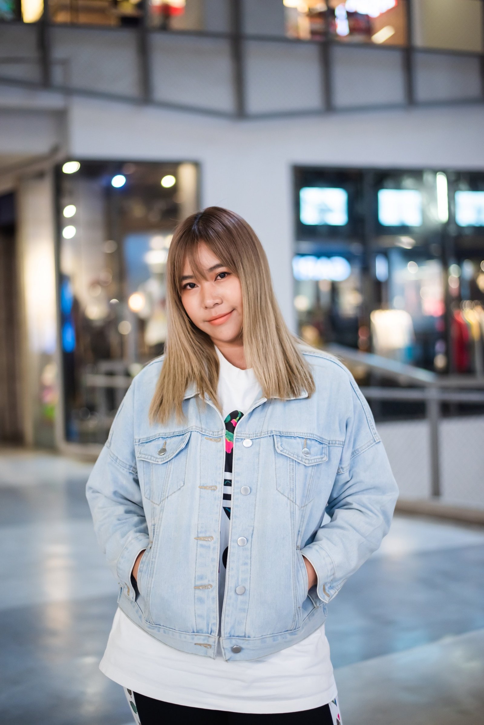 Asian woman with ash brown hair