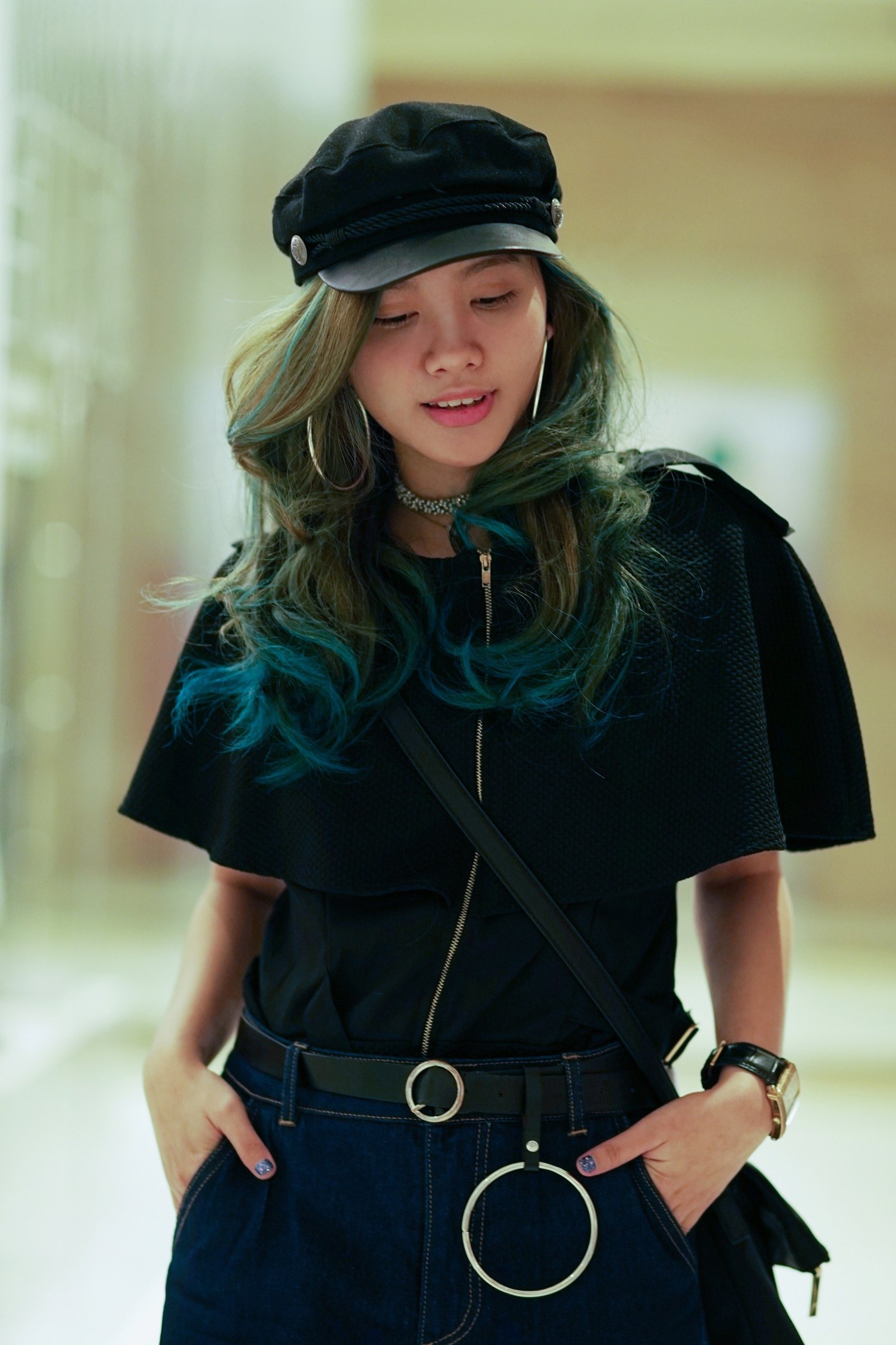 Asian woman with green hair