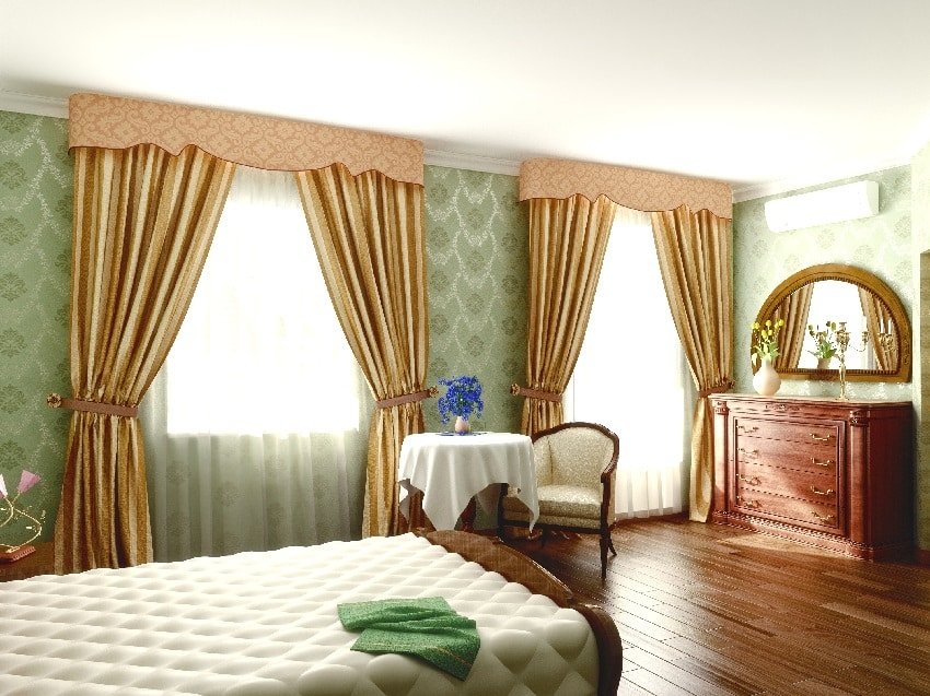 Bedroom with gold tie up curtains