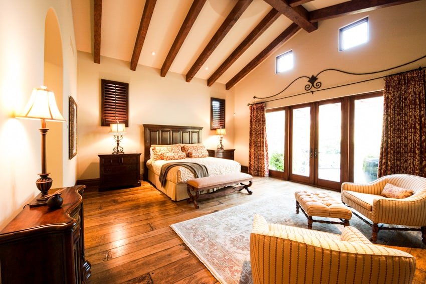 Spacious bedrooom with gold finishes